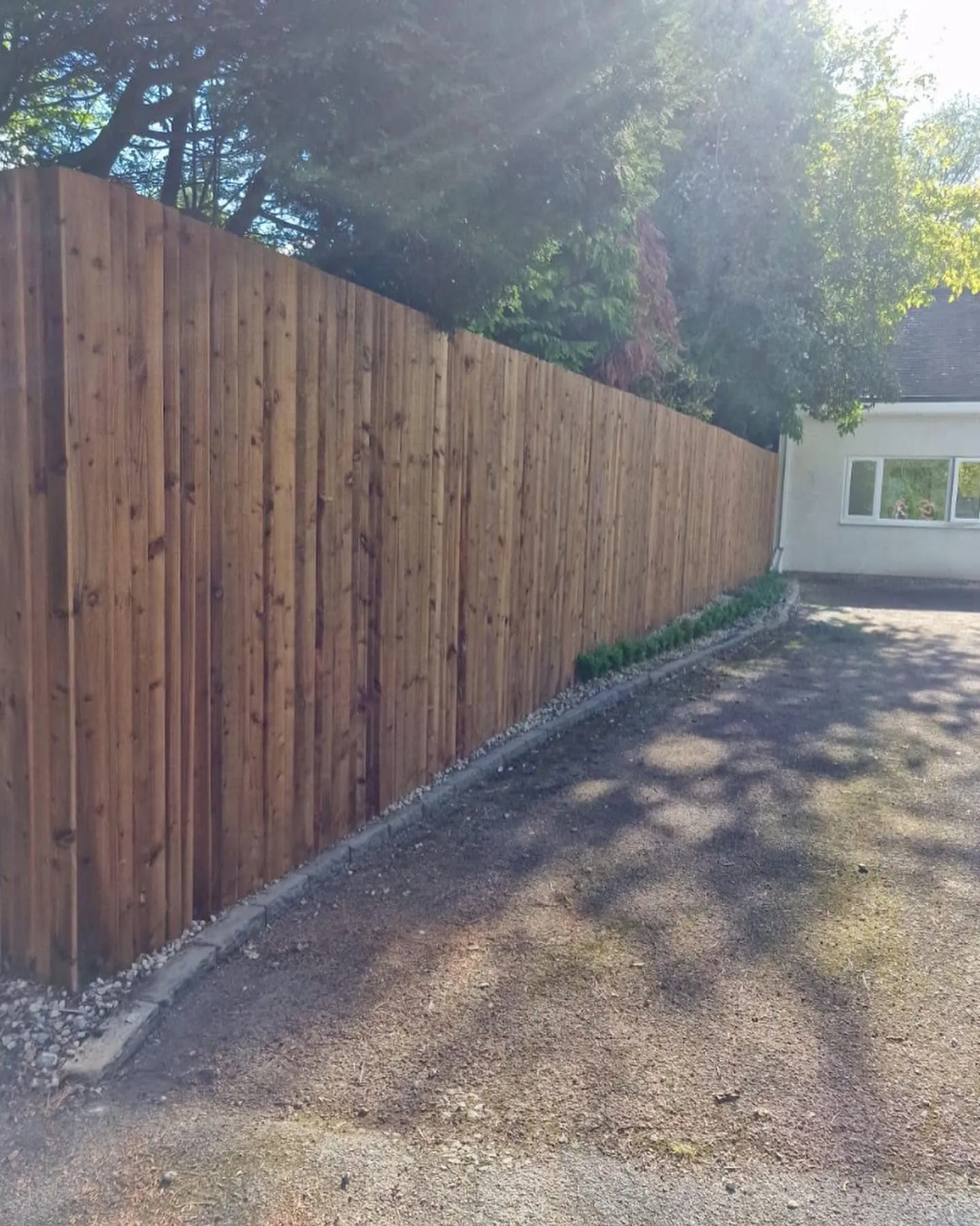 New closeboard timber fence along a driveway in Solihull