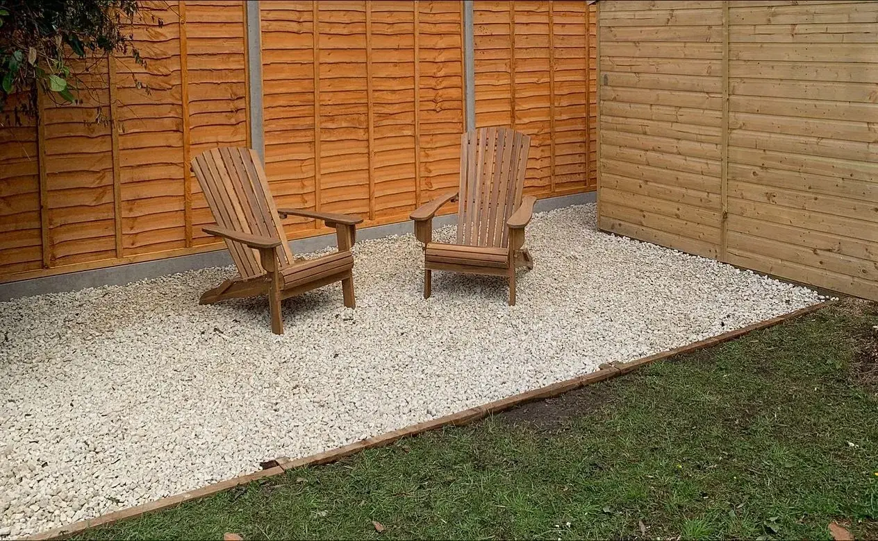 Gravel seating area with timber edging in a Solihull garden