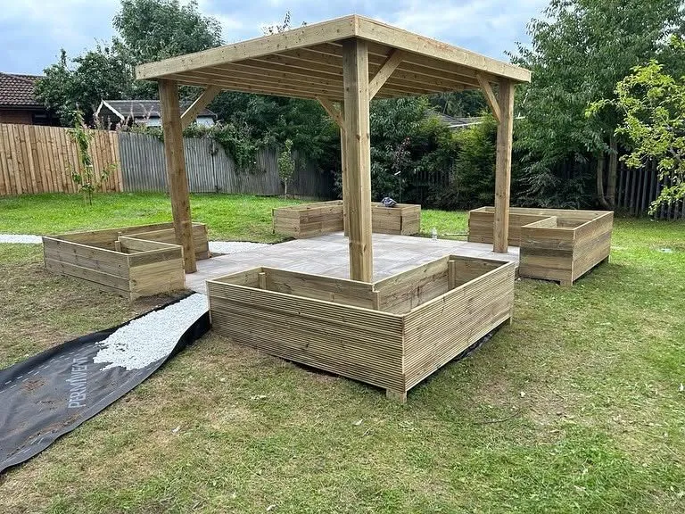 Timber pergola and raised planters built in a Solihull garden
